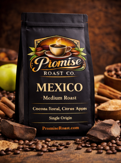 Coffee bag from Promise Roast Co with coffee beans and cinnamon sticks on a wooden surface